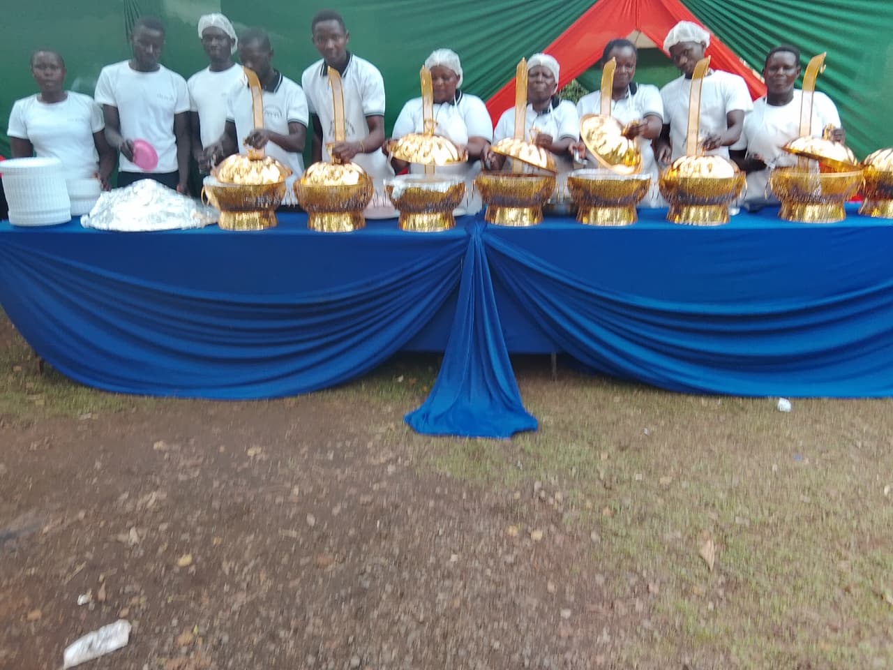 Corporate event catering with buffet tables and professional staff