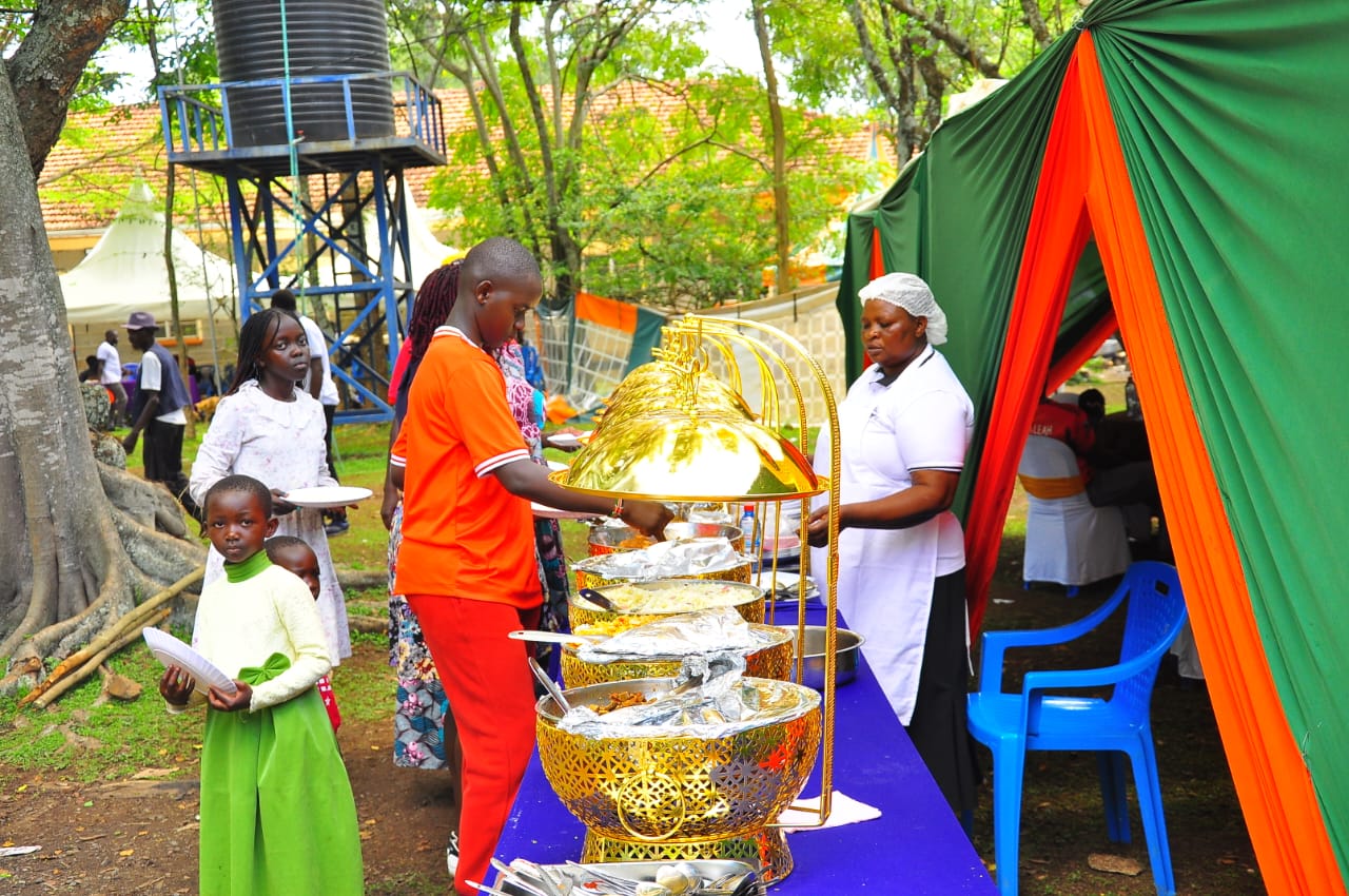 Outdoor event setup with tents and catering equipment